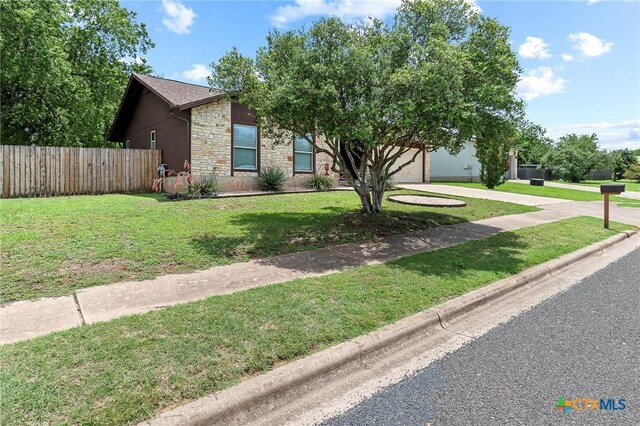 907 Great Oaks Cv, Round Rock, TX 78681 - view of front of home with stone siding and driveway