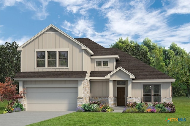 view of front of home with a front yard and a garage