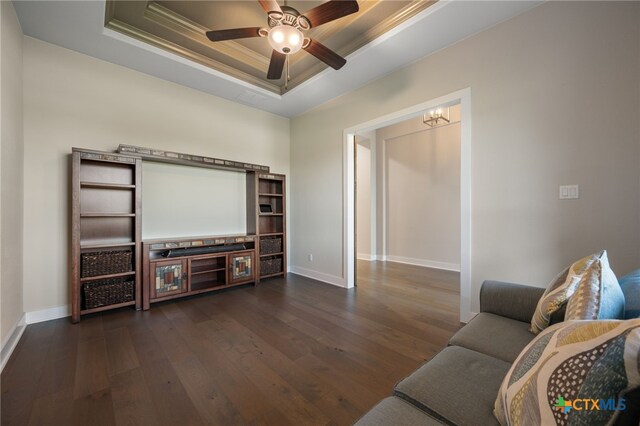 916 Dream Catcher Dr, Leander, TX 78641 - living area with a raised ceiling, ornamental molding, dark wood finished floors, baseboards, and a ceiling fan
