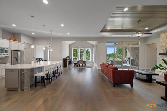 916 Dream Catcher Dr, Leander, TX 78641 - living room with ceiling fan, recessed lighting, and dark wood-type flooring