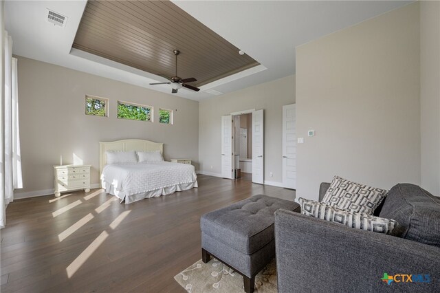 916 Dream Catcher Dr, Leander, TX 78641 - bedroom with a tray ceiling, dark wood-style floors, baseboards, ceiling fan, and wooden ceiling
