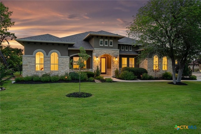 916 Dream Catcher Dr, Leander, TX 78641 - view of front of home with stone siding, stucco siding, and a front lawn