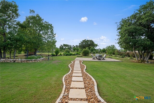 916 Dream Catcher Dr, Leander, TX 78641 - view of grassy yard with a patio area