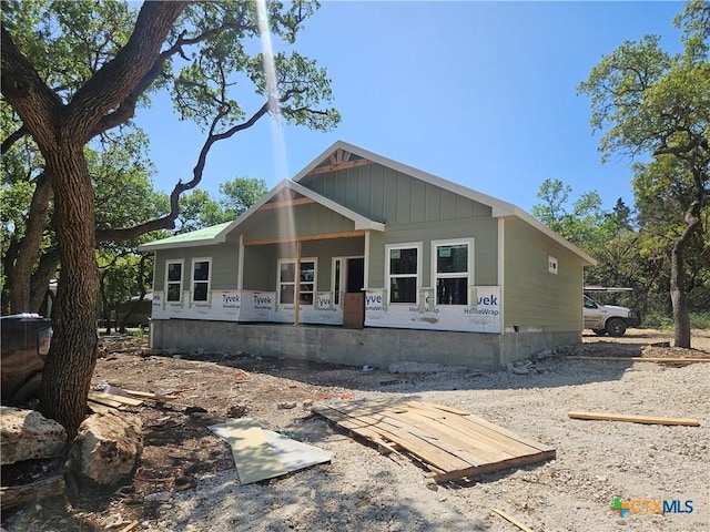 view of front of house with board and batten siding and covered porch
