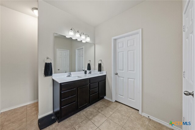 bathroom with vanity and tile patterned flooring