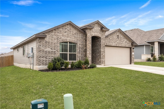 view of front of house featuring a garage and a front yard