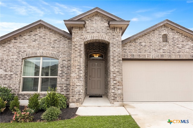 property entrance with a garage