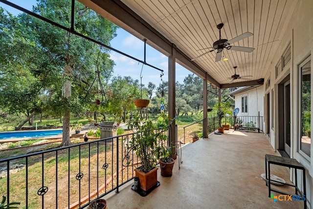 view of patio / terrace featuring ceiling fan and a balcony