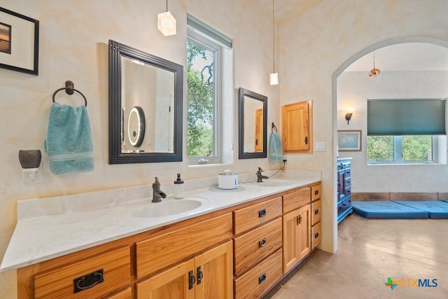 bathroom with vanity and concrete floors