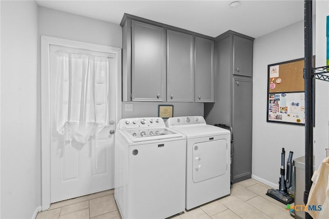 407 Pasadena Dr, Victoria, TX 77904 - laundry area with independent washer and dryer, cabinet space, light tile patterned flooring, and baseboards