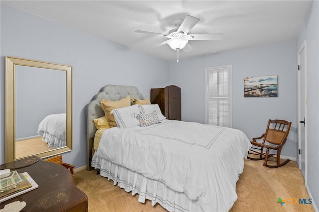 407 Pasadena Dr, Victoria, TX 77904 - bedroom featuring light colored carpet, baseboards, and ceiling fan