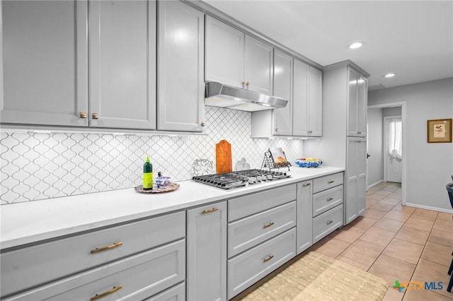 407 Pasadena Dr, Victoria, TX 77904 - kitchen featuring gray cabinetry, under cabinet range hood, stainless steel gas stovetop, light countertops, and recessed lighting