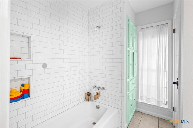 407 Pasadena Dr, Victoria, TX 77904 - bathroom featuring tile patterned flooring and shower / tub combination