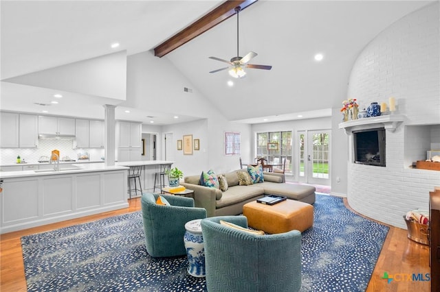 407 Pasadena Dr, Victoria, TX 77904 - living area with light wood finished floors, beam ceiling, a ceiling fan, high vaulted ceiling, and recessed lighting