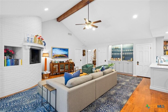 407 Pasadena Dr, Victoria, TX 77904 - living area with beam ceiling, a ceiling fan, wood finished floors, high vaulted ceiling, and recessed lighting