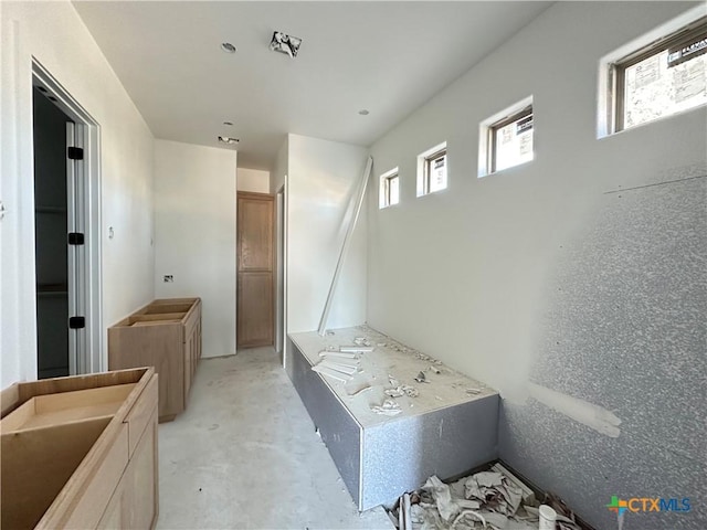 bathroom featuring concrete floors