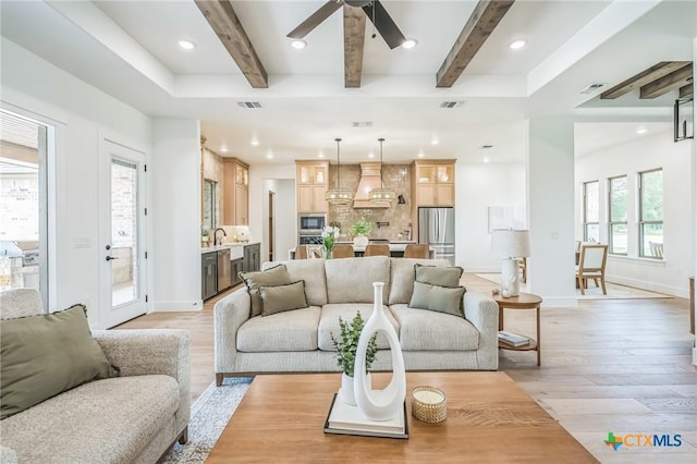 1586 Bosque Lago Dr, Belton, TX 76513 - living room with beamed ceiling, light wood-type flooring, a ceiling fan, recessed lighting, and baseboards