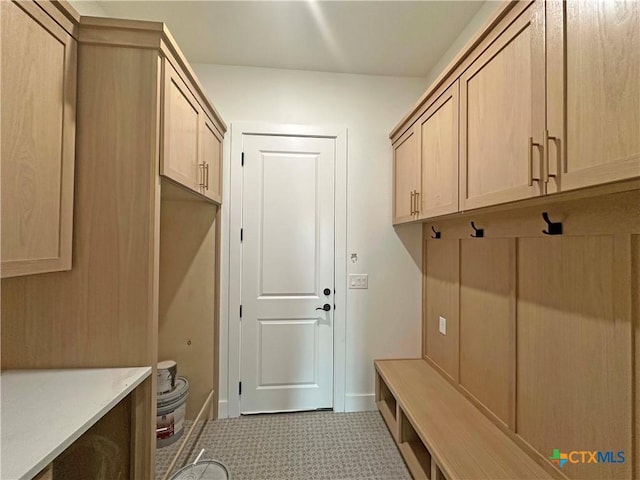 mudroom featuring baseboards