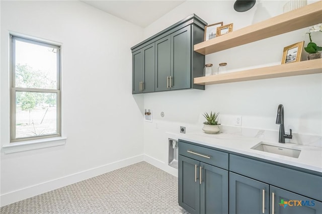1586 Bosque Lago Dr, Belton, TX 76513 - laundry room featuring cabinet space, hookup for an electric dryer, baseboards, light carpet, and hookup for a washing machine