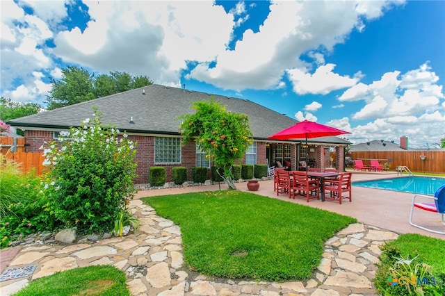1306 Falcon Trl, Copperas Cove, TX 76522 - back of property with brick siding, a patio area, and a shingled roof
