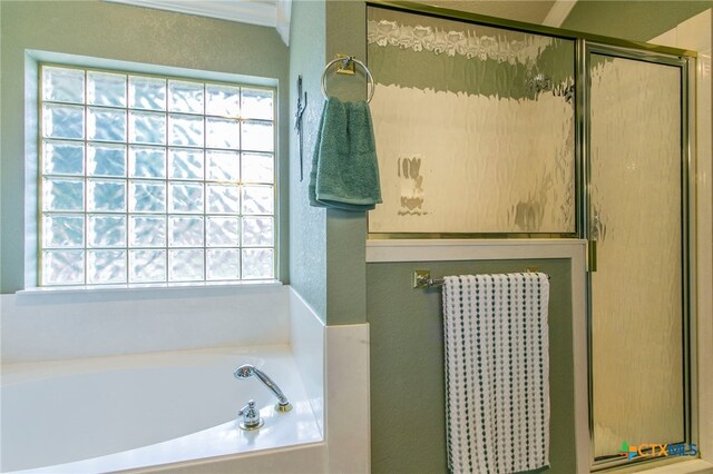 1306 Falcon Trl, Copperas Cove, TX 76522 - bathroom featuring healthy amount of natural light, a bath, and a stall shower