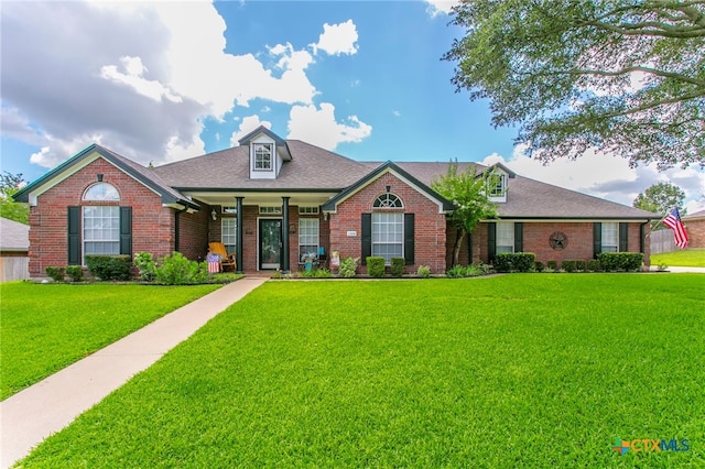 1306 Falcon Trl, Copperas Cove, TX 76522 - view of front facade featuring brick siding, a front lawn, and a shingled roof