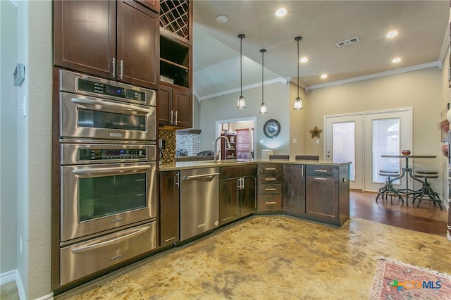 1306 Falcon Trl, Copperas Cove, TX 76522 - kitchen featuring appliances with stainless steel finishes, crown molding, a warming drawer, dark brown cabinets, and a peninsula