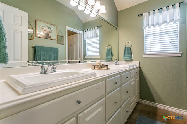 1306 Falcon Trl, Copperas Cove, TX 76522 - full bathroom featuring double vanity, healthy amount of natural light, and vaulted ceiling