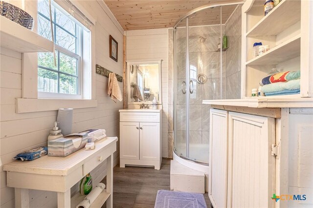 758 Margie Tewmey Rd, Port Lavaca, TX 77979 - full bathroom with a shower stall, vanity, wood ceiling, and wood finished floors