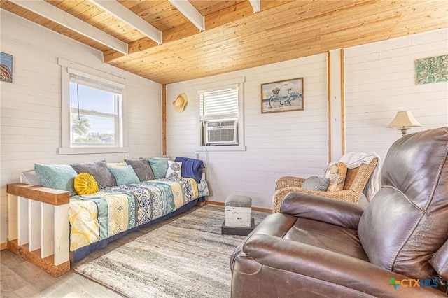 758 Margie Tewmey Rd, Port Lavaca, TX 77979 - living area with a wooden ceiling with exposed beams, wood finished floors, cooling unit, and wood walls