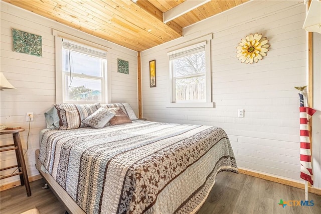 758 Margie Tewmey Rd, Port Lavaca, TX 77979 - bedroom featuring a wooden ceiling with exposed beams, wood finished floors, and wooden walls