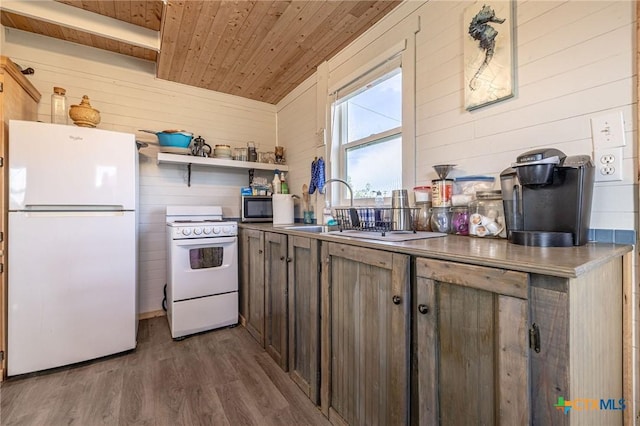 758 Margie Tewmey Rd, Port Lavaca, TX 77979 - kitchen featuring white appliances, wooden ceiling, wooden walls, wood finished floors, and open shelves
