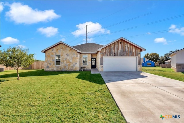 ranch-style home featuring a front yard and a garage