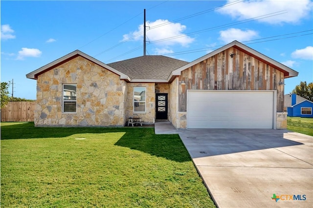 view of front facade featuring a garage and a front lawn