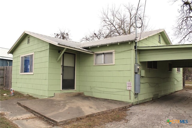 rear view of property featuring a patio