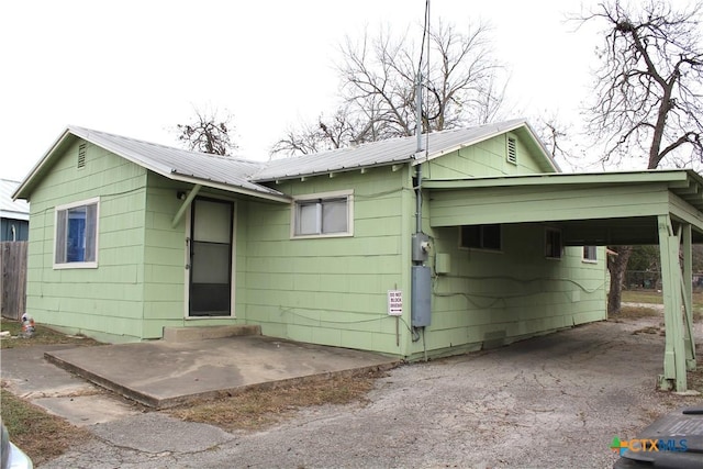 exterior space featuring a carport