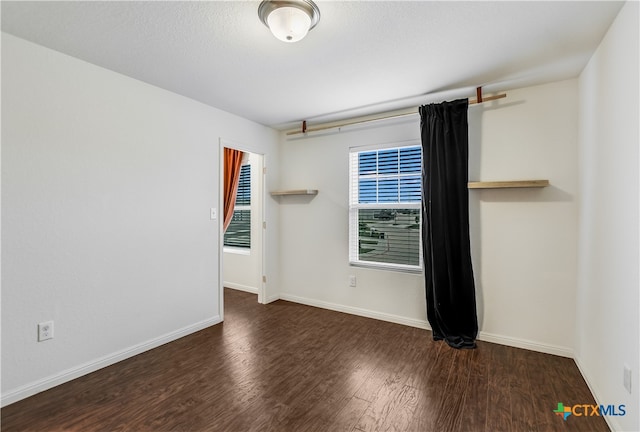 225 Rainey Dr Unit 73A, Jarrell, TX 76537 - empty room featuring wood finished floors and baseboards
