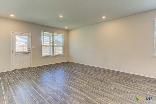 empty room featuring dark hardwood / wood-style floors