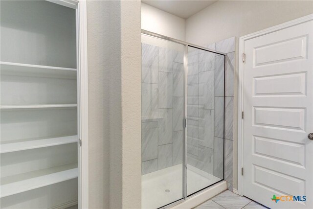 2420 Dielman Dr, Seguin, TX 78155 - bathroom with a stall shower and a spacious closet