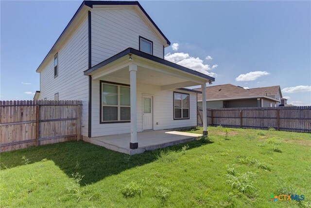 2420 Dielman Dr, Seguin, TX 78155 - back of house featuring a patio area
