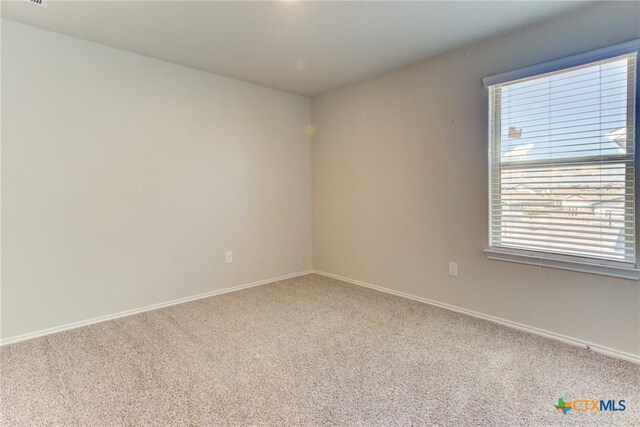 2420 Dielman Dr, Seguin, TX 78155 - carpeted spare room featuring baseboards
