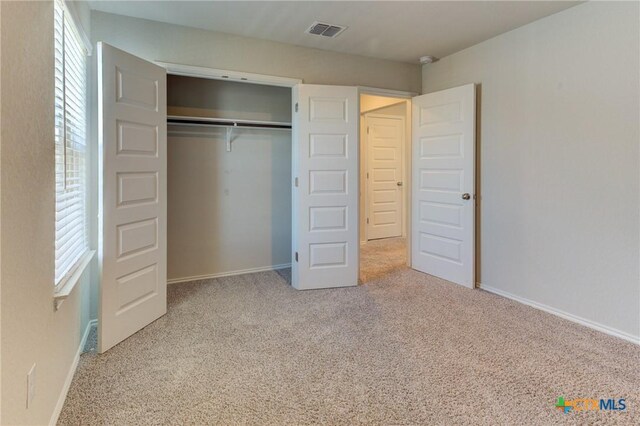 2420 Dielman Dr, Seguin, TX 78155 - unfurnished bedroom with carpet flooring, a closet, and baseboards