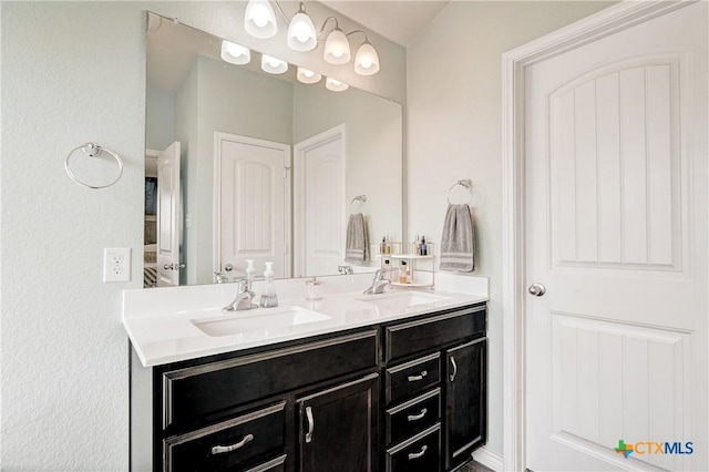 bathroom featuring double vanity and a sink