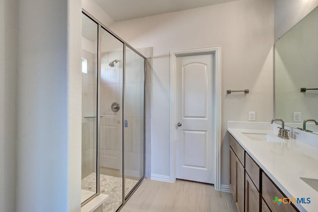 bathroom featuring vanity and walk in shower