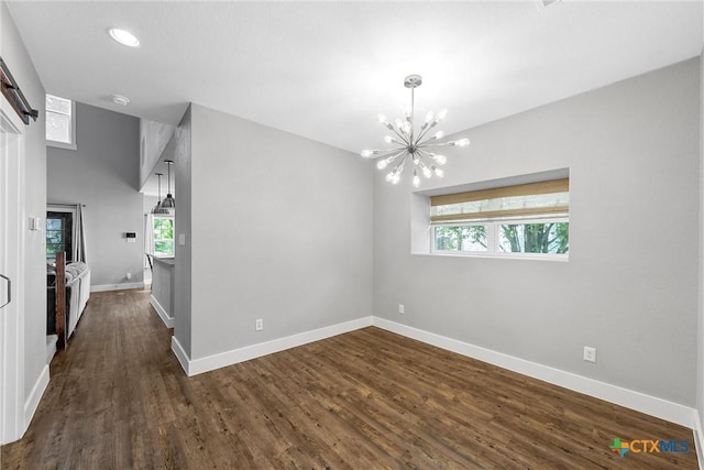 4130 Cripple Creek Dr, Temple, TX 76502 - unfurnished dining area with dark wood-type flooring, baseboards, and an inviting chandelier