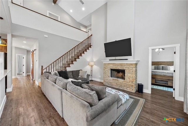 4130 Cripple Creek Dr, Temple, TX 76502 - living area with high vaulted ceiling, baseboards, wood finished floors, and stairway