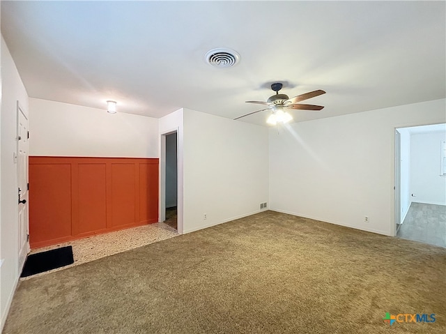 bonus room with carpet floors and ceiling fan