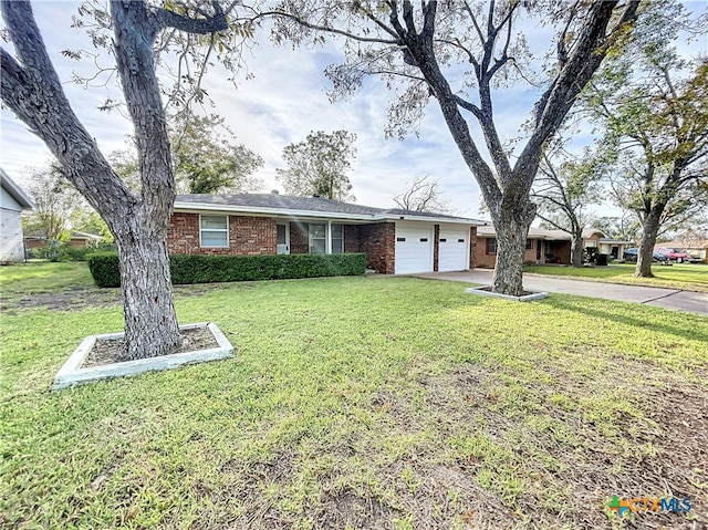 ranch-style home with a garage and a front lawn