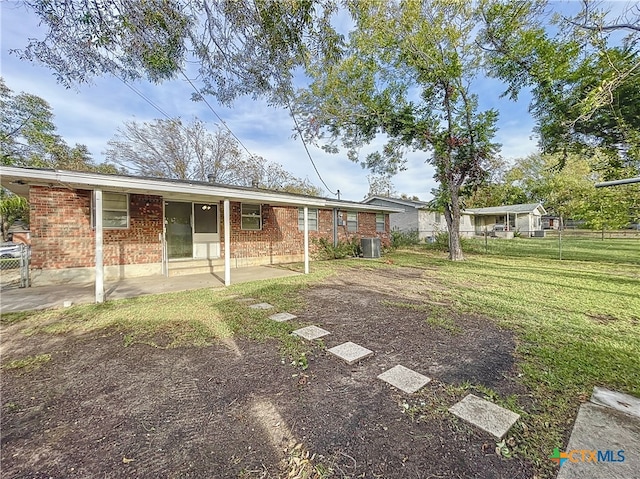 view of yard featuring cooling unit and a patio area