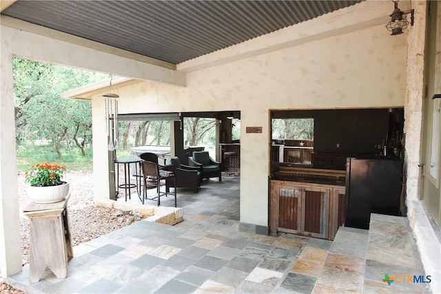 211 Cambridge Dr, New Braunfels, TX 78132 - view of patio with outdoor dry bar and exterior kitchen
